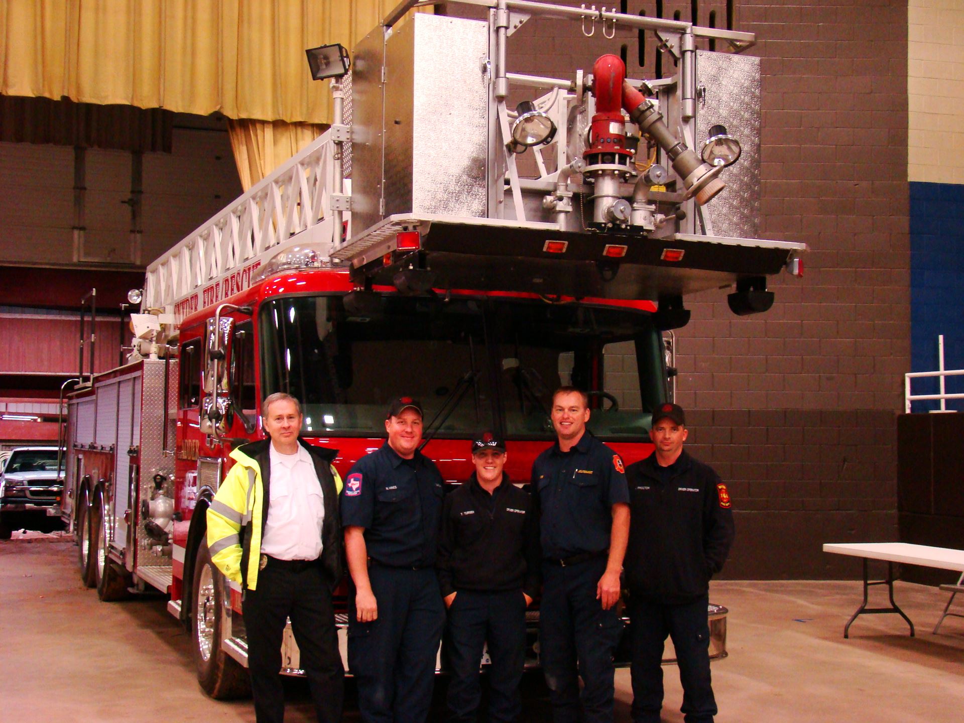 Employees of the Snyder Fire Department pose for picture in front of truck.